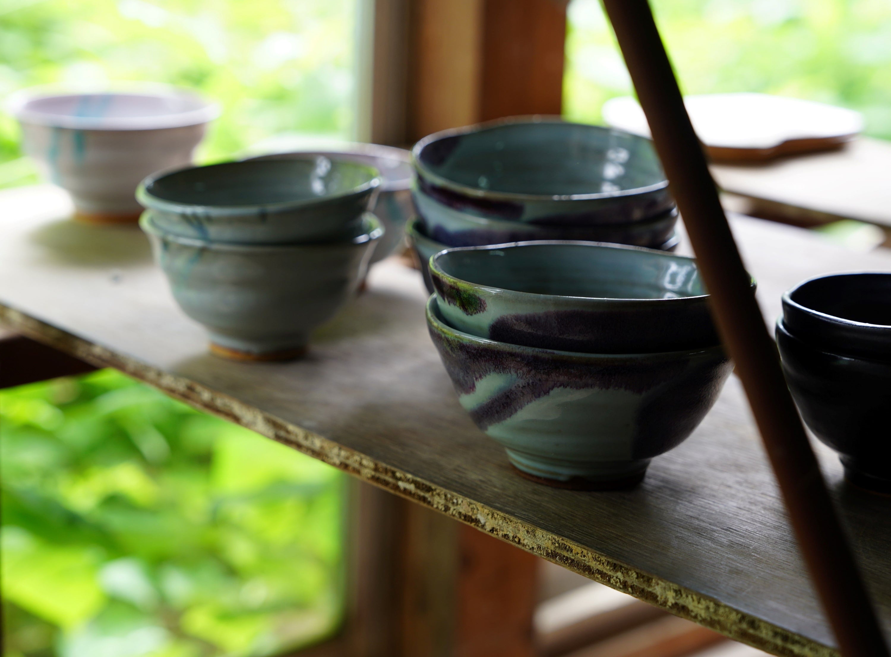 Finished Hagi yaki bowls on a shelf in Hagi, Japan