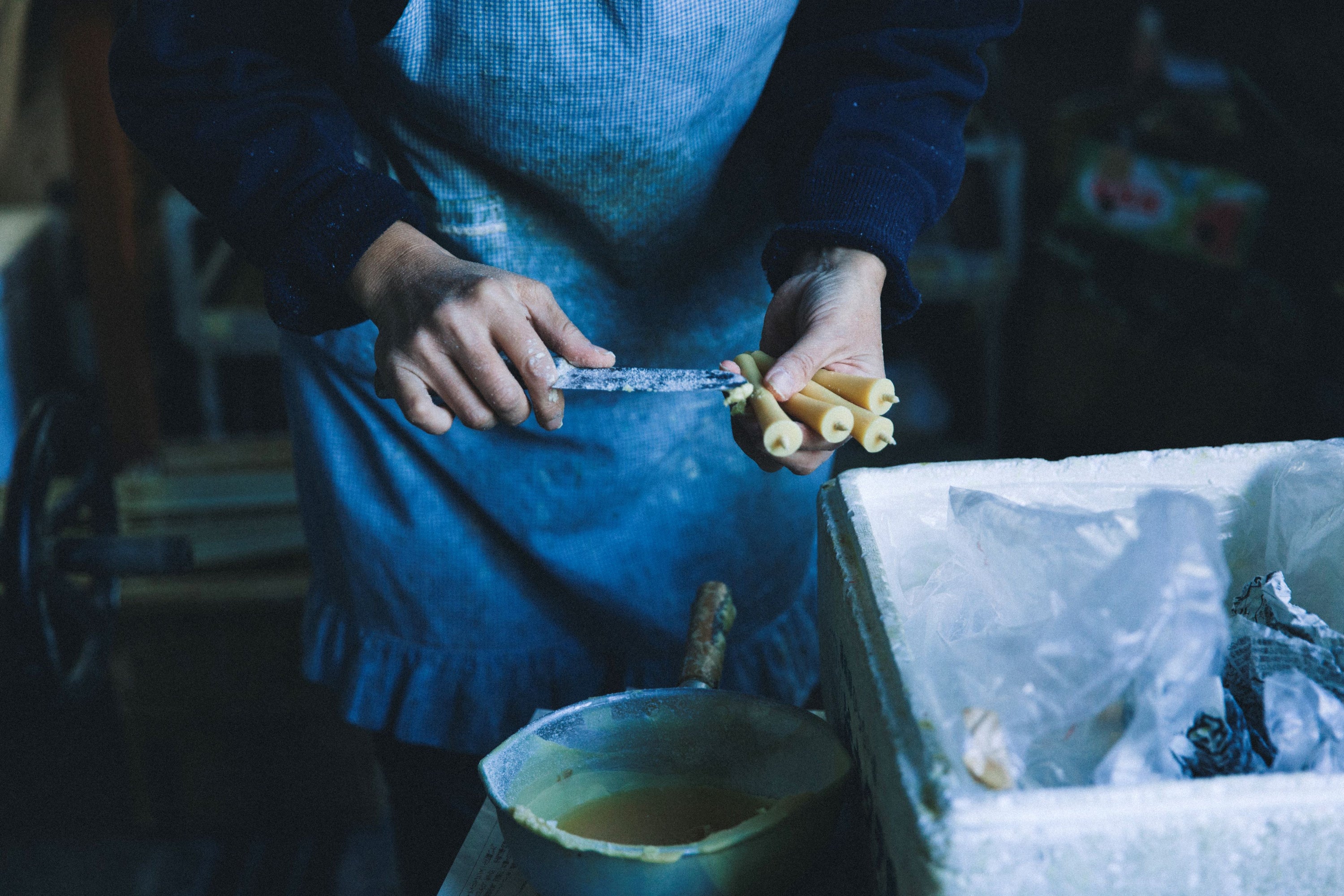 Daiyo candles being cleaned up before packing