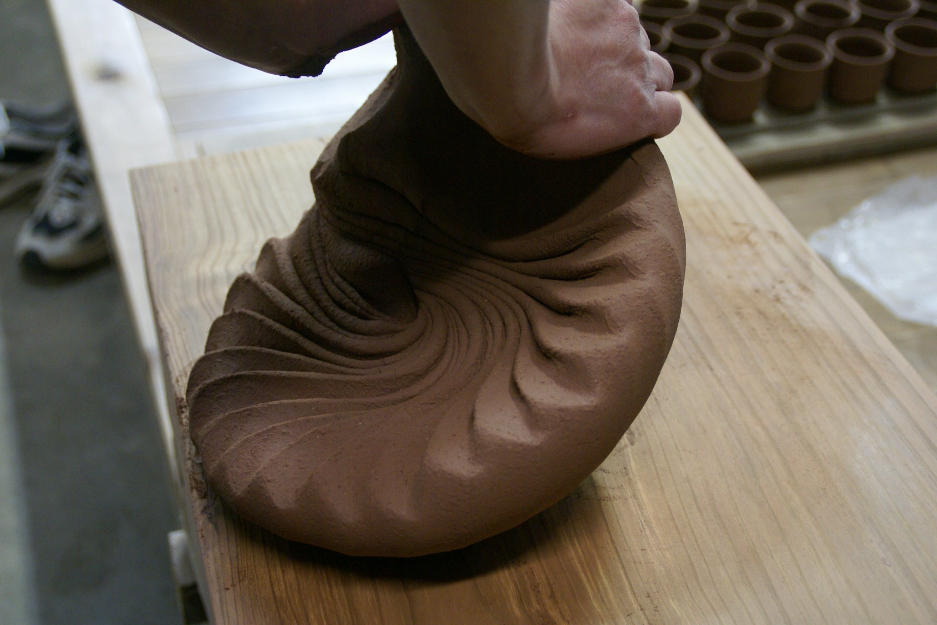 Wedging clay at Senryuzan Kiln in Hagi