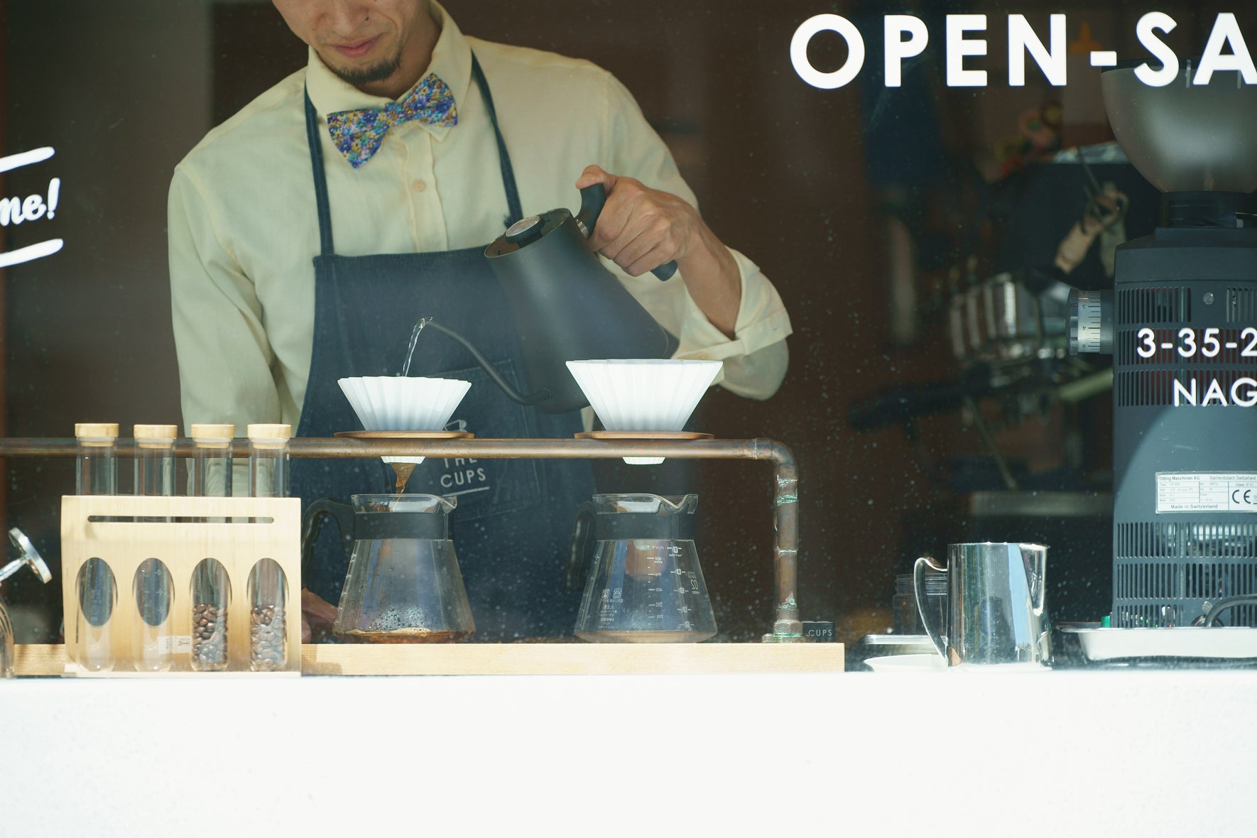 ORIGAMI coffee drippers being used by a barista in Japan