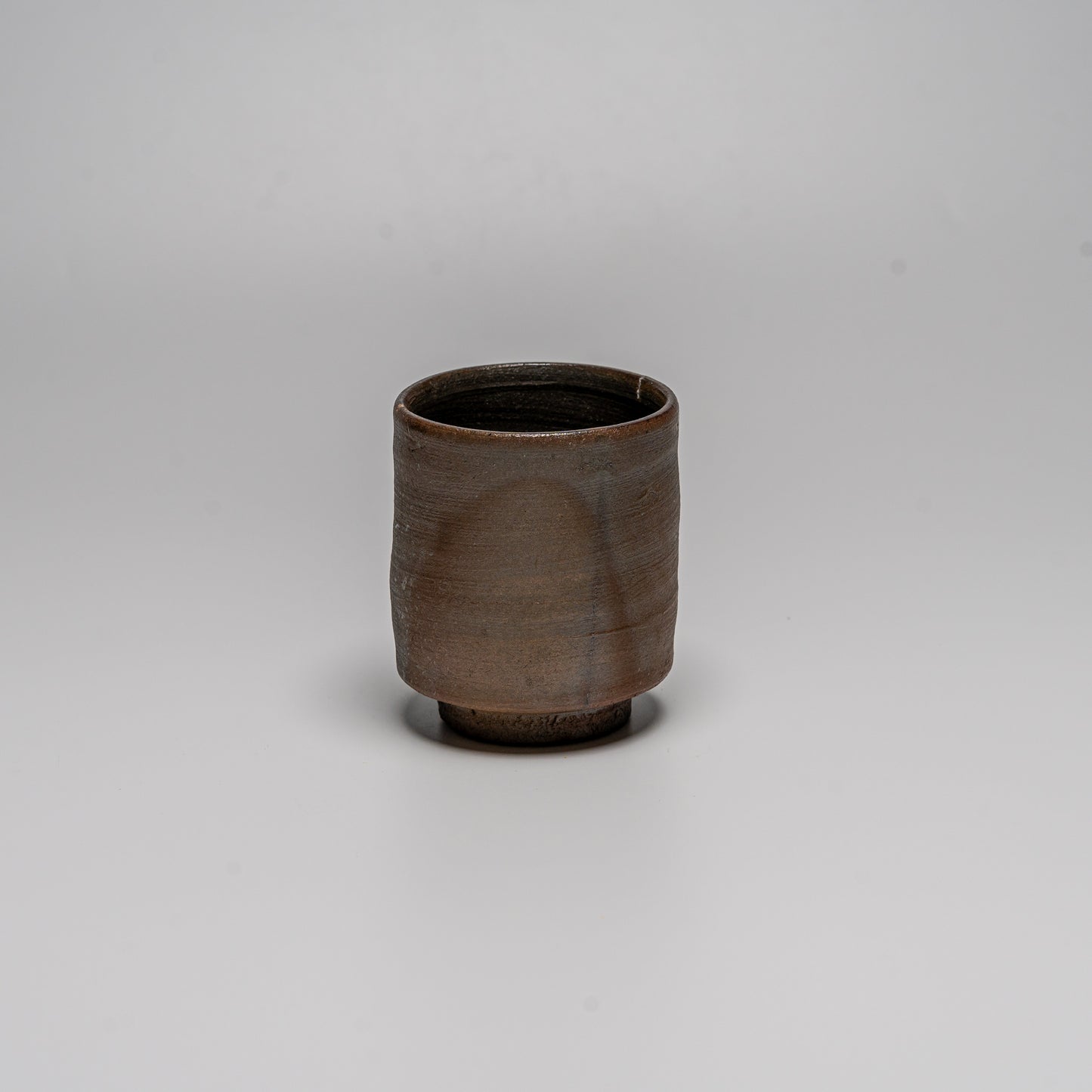 Yakishime cup photographed on white