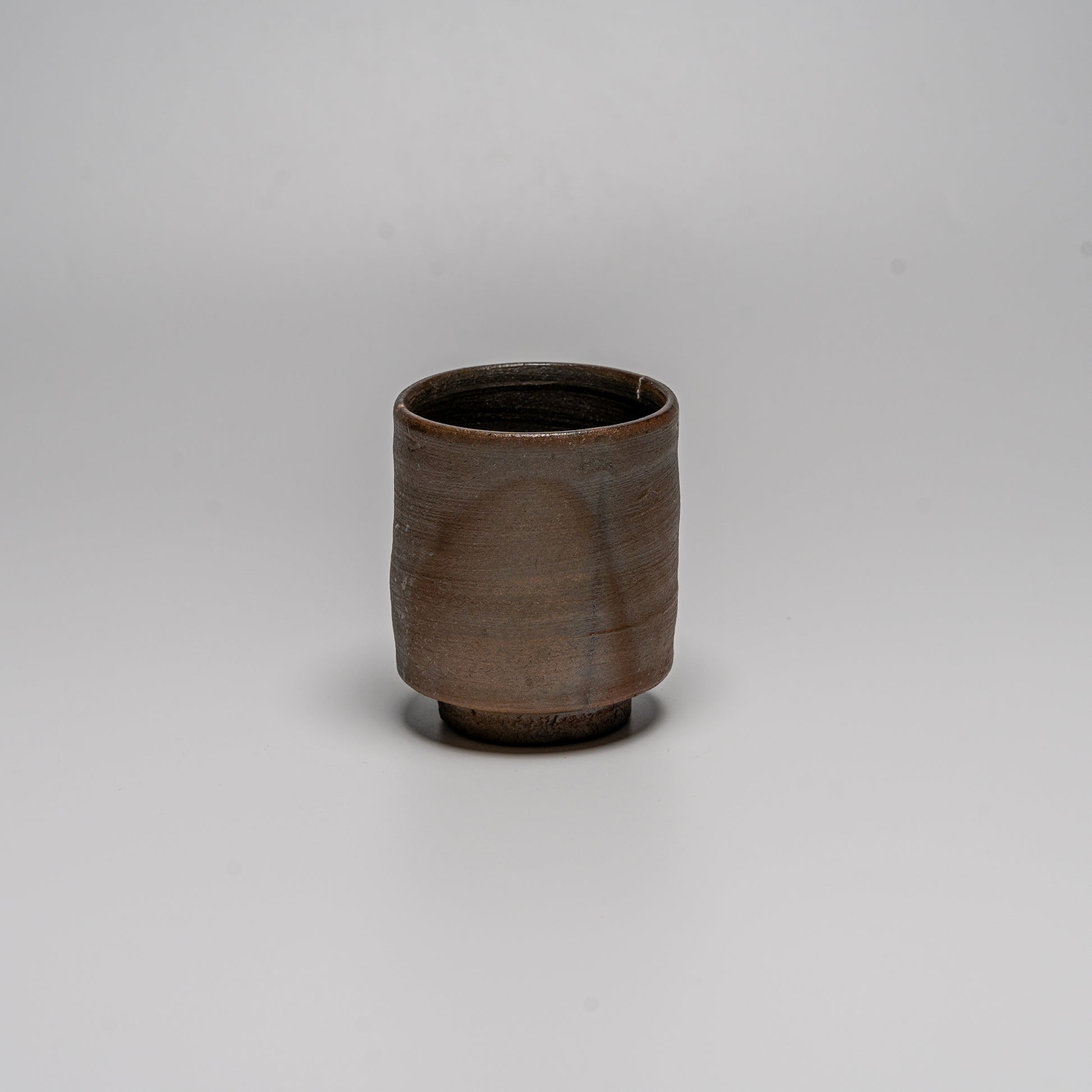 Yakishime cup photographed on white
