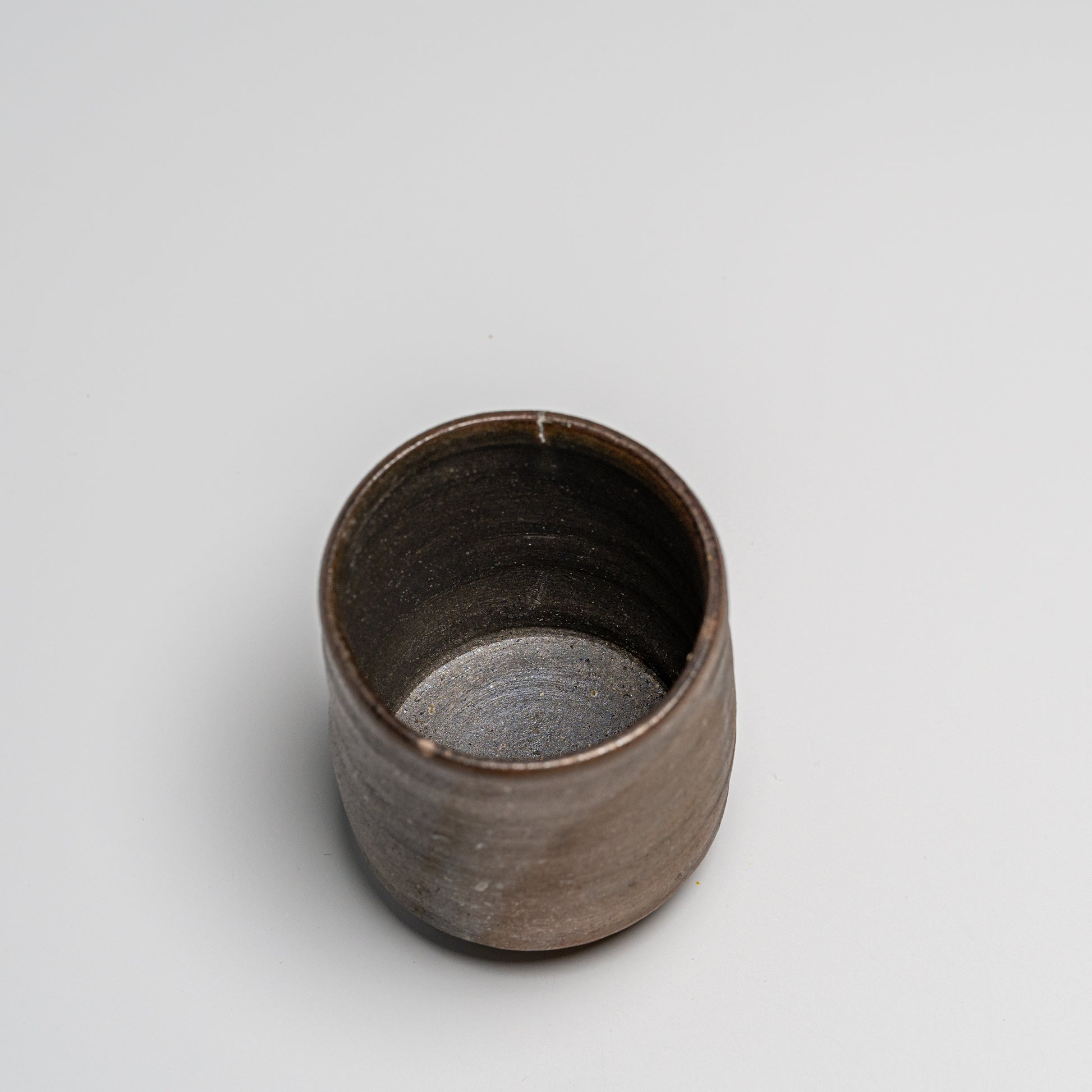 Yakishime cup photographed on white