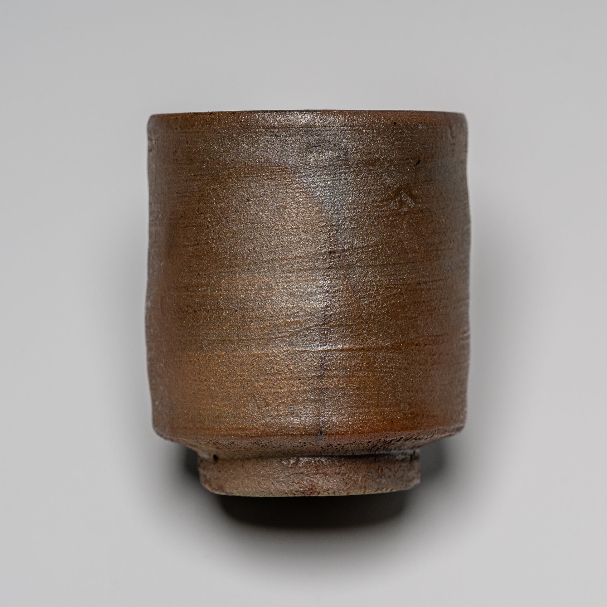 Yakishime cup photographed on white