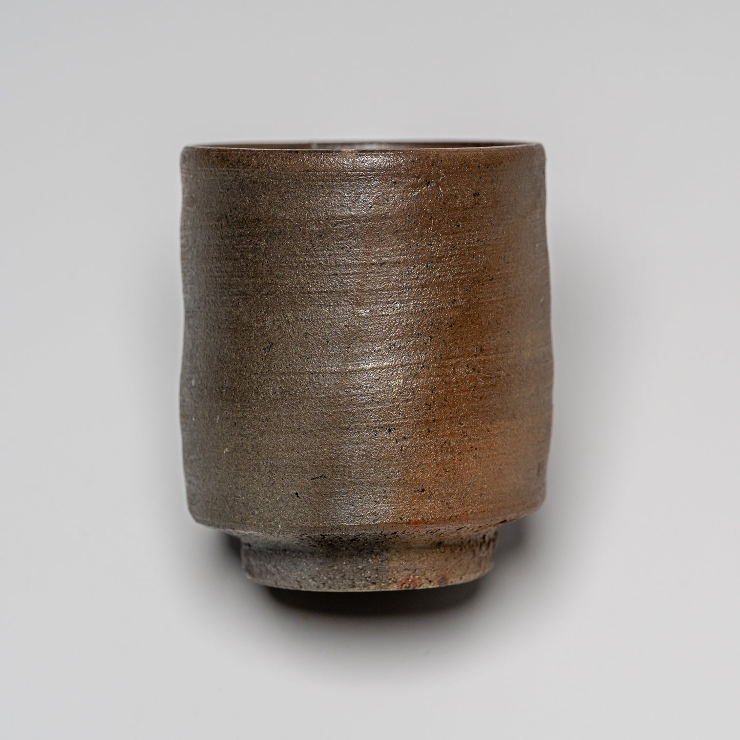 Yakishime cup photographed on white