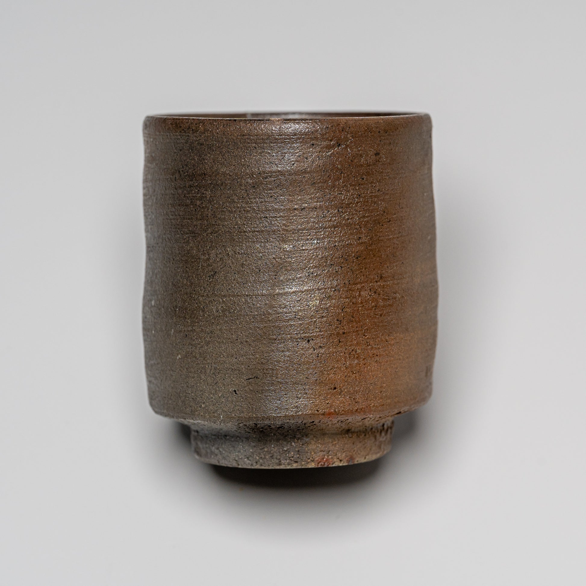 Yakishime cup photographed on white