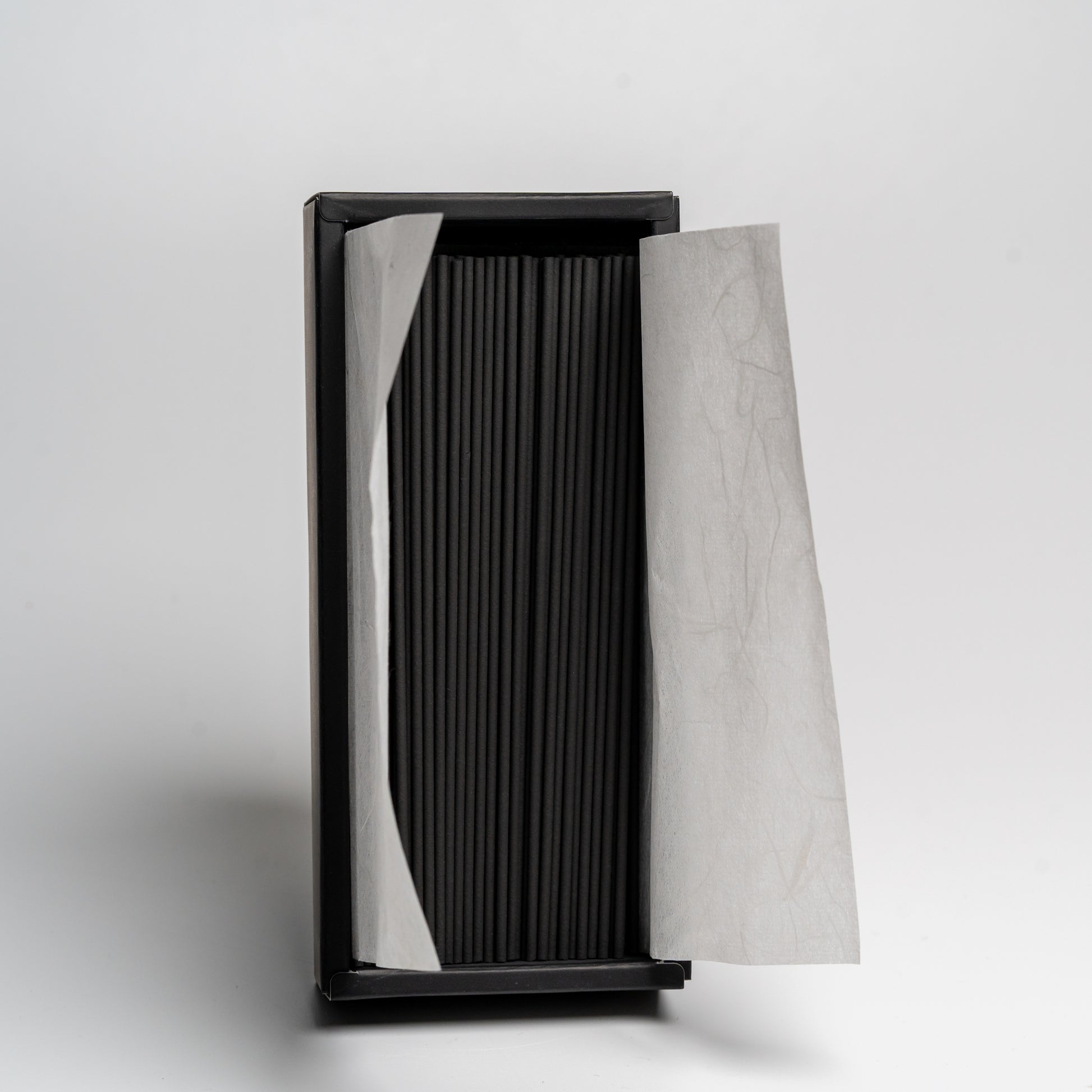 An open box of Bamboo Japanese incense on white