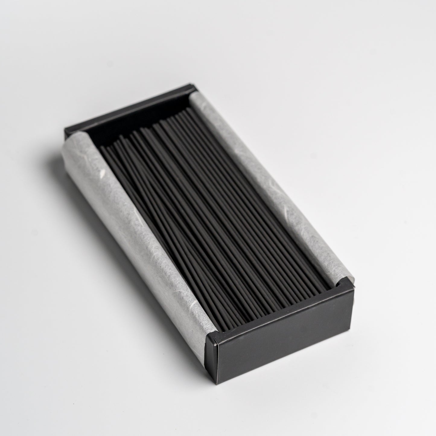 An open box of Bamboo Japanese incense on white