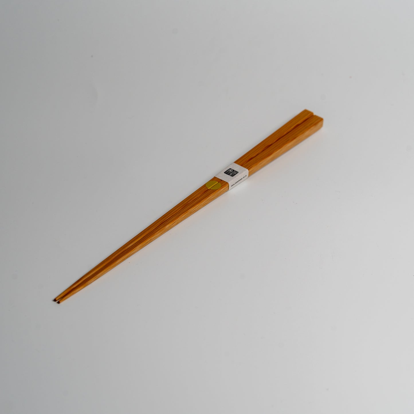 Japanese bamboo chopsticks with a gold circle