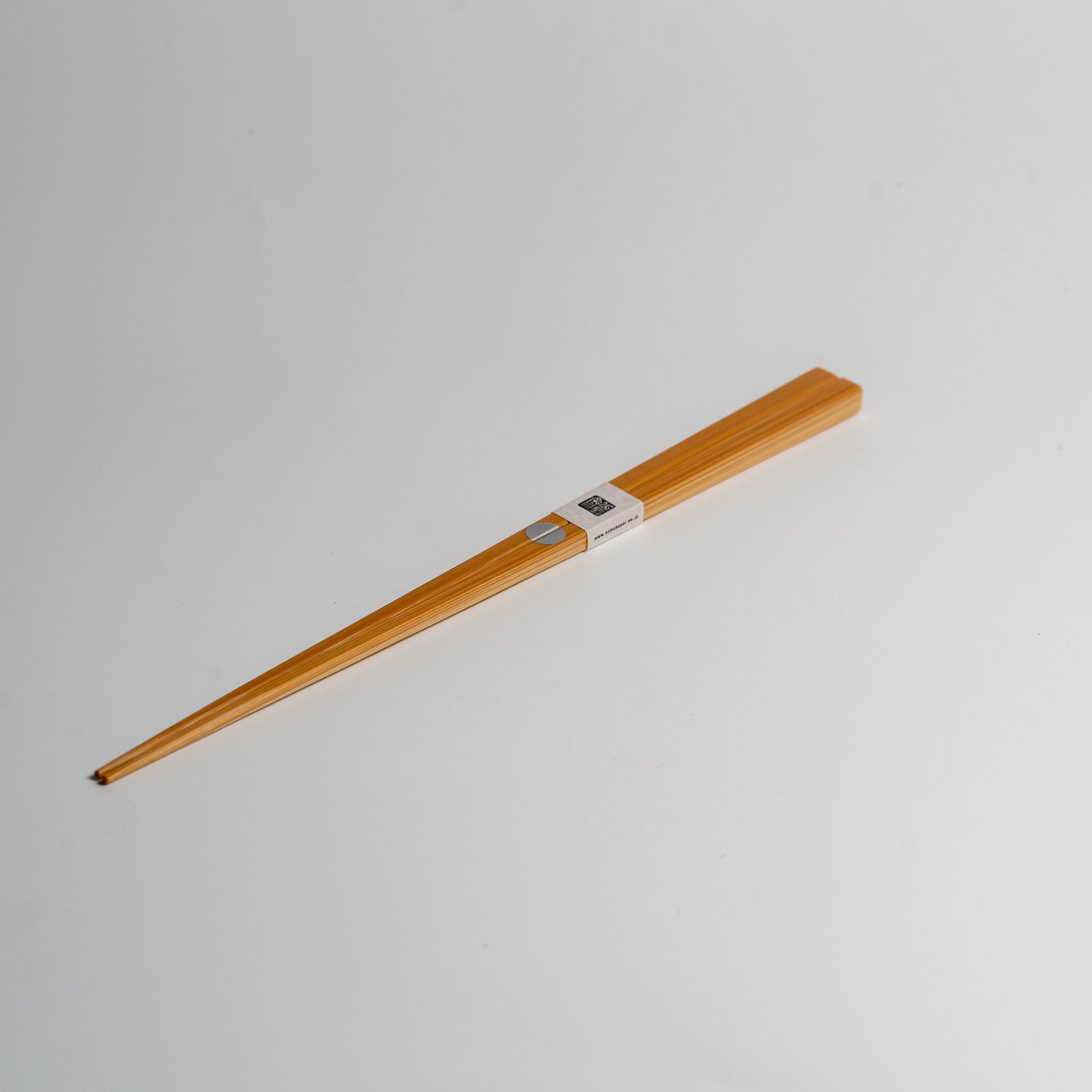 Japanese bamboo chopsticks with a silver circle