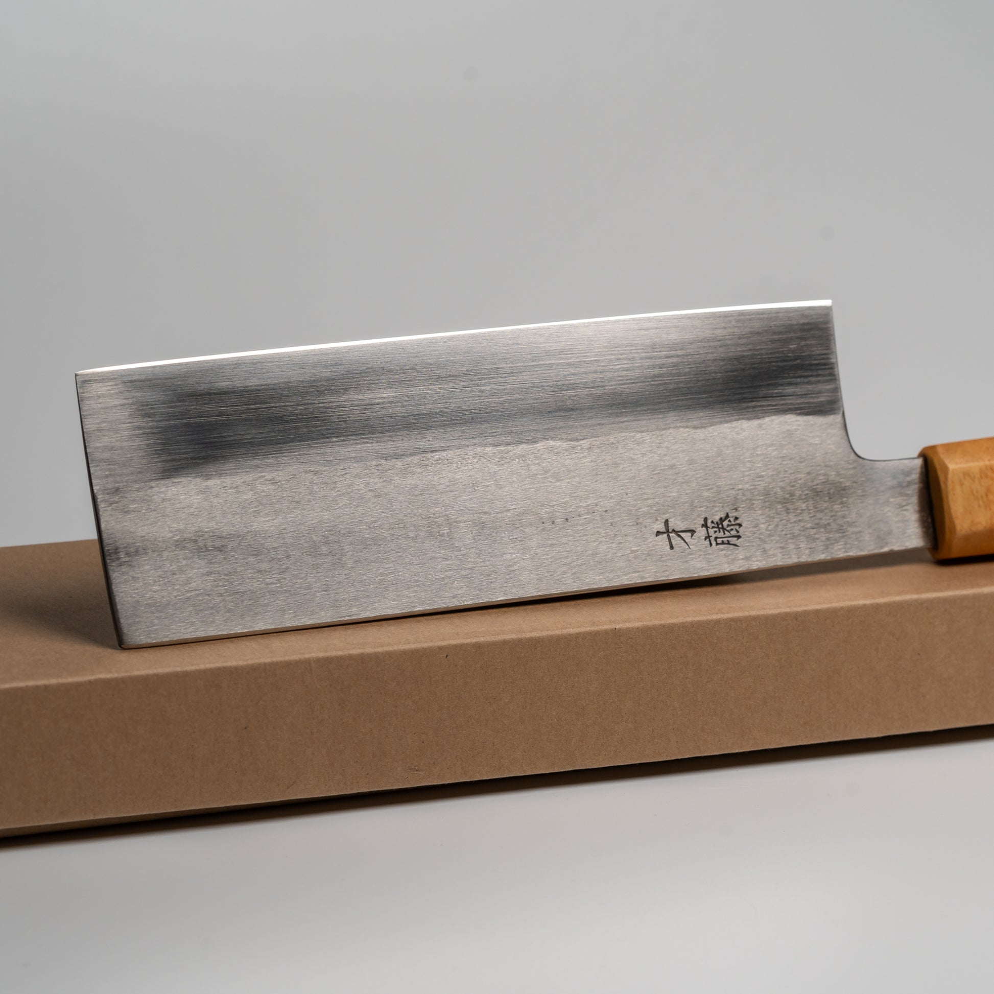 Close up of a Japanese Nakiri knife on its box