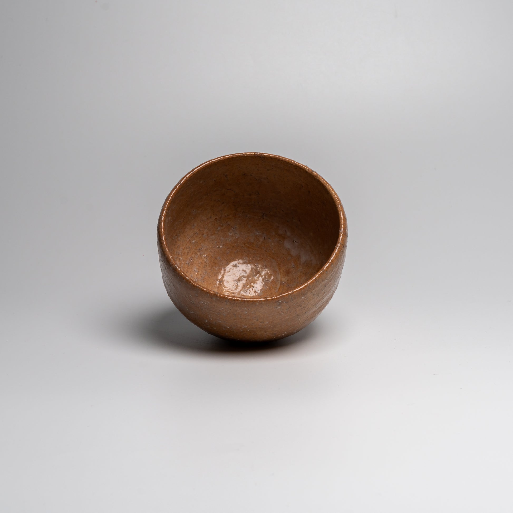 Japanese ceramic matcha tea bowl on white