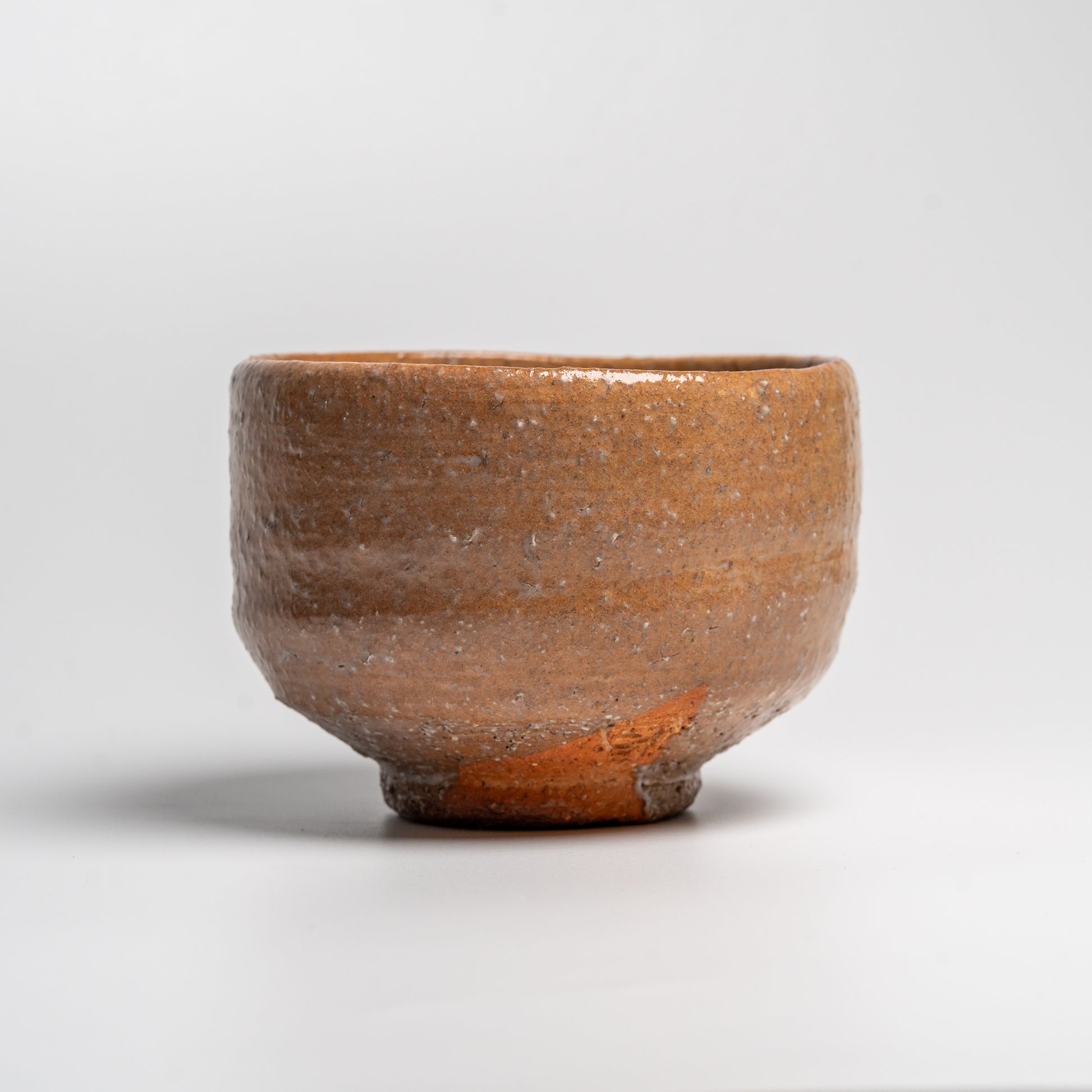 Japanese ceramic matcha tea bowl on white