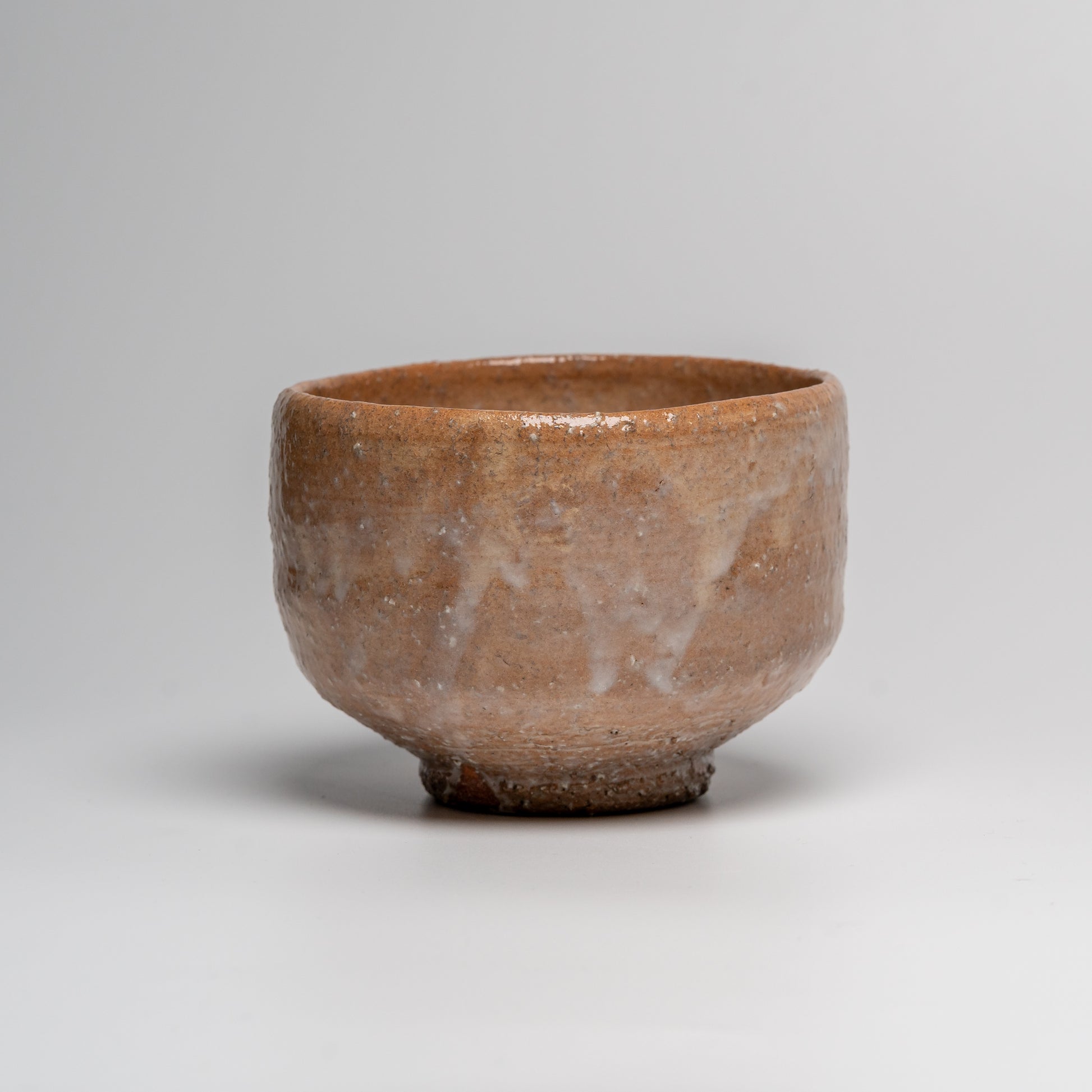 Japanese ceramic matcha tea bowl on white