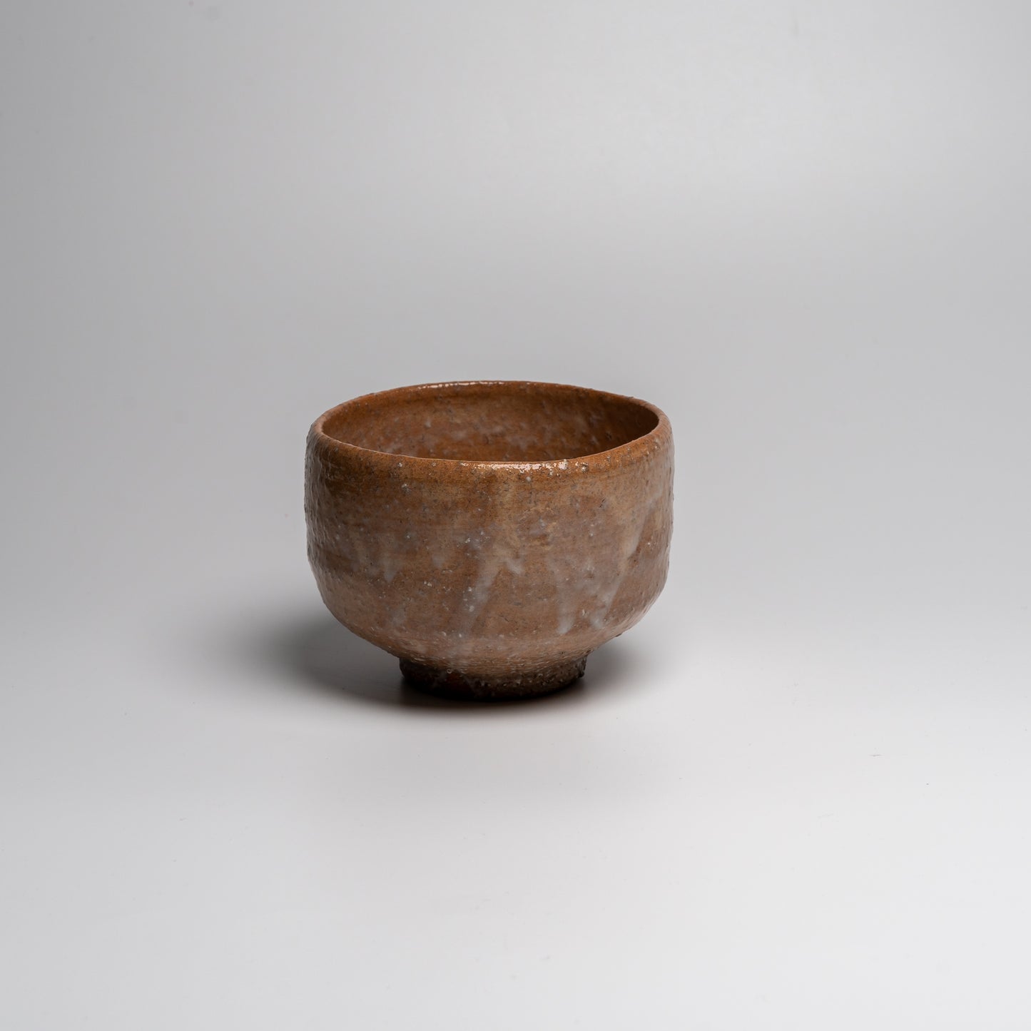 Japanese ceramic matcha tea bowl on white