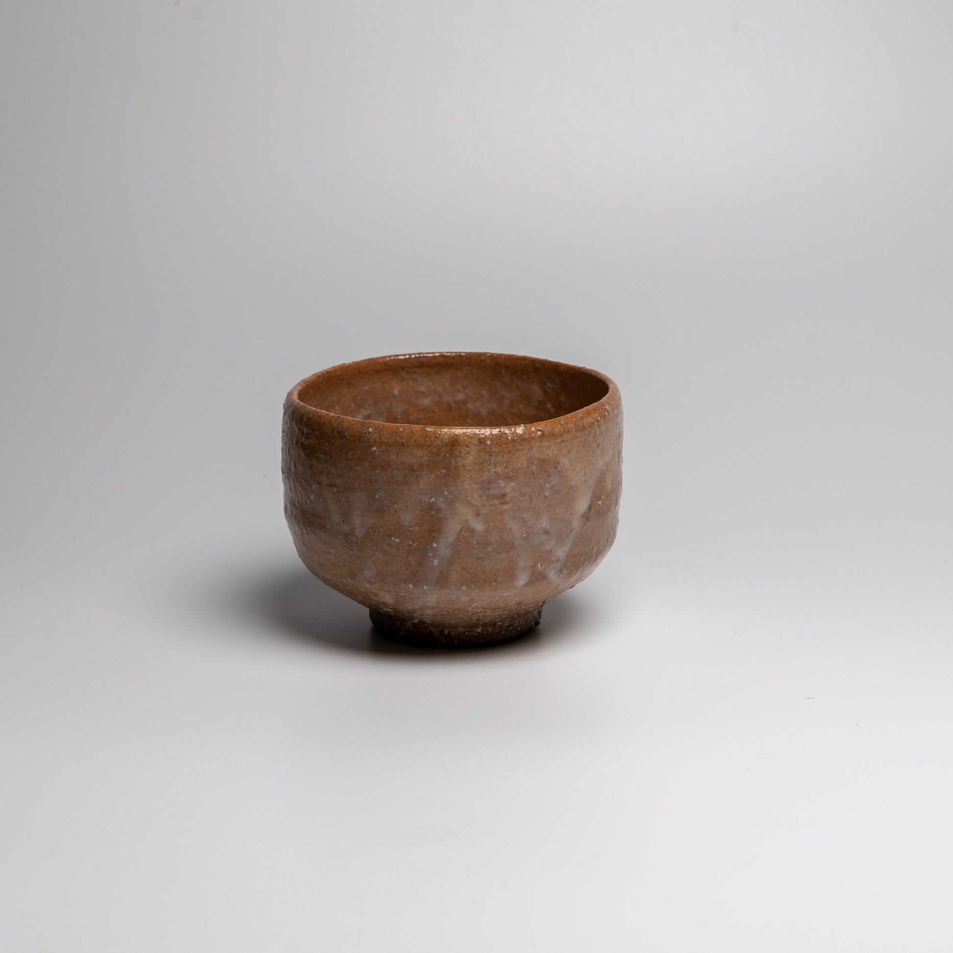 Japanese ceramic matcha tea bowl on white