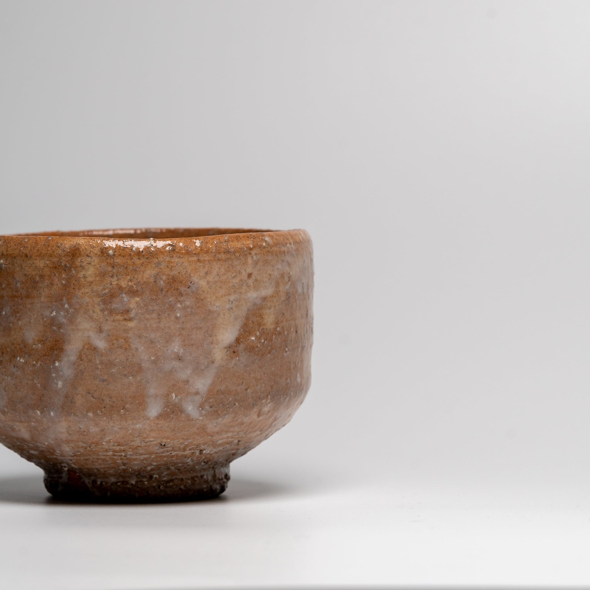 Japanese ceramic matcha tea bowl on white