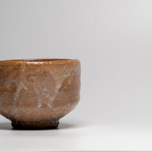 Japanese ceramic matcha tea bowl on white