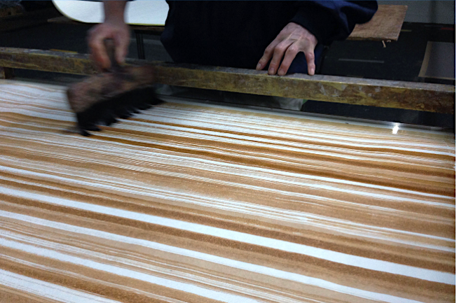 Washi paper being painted with natural dye