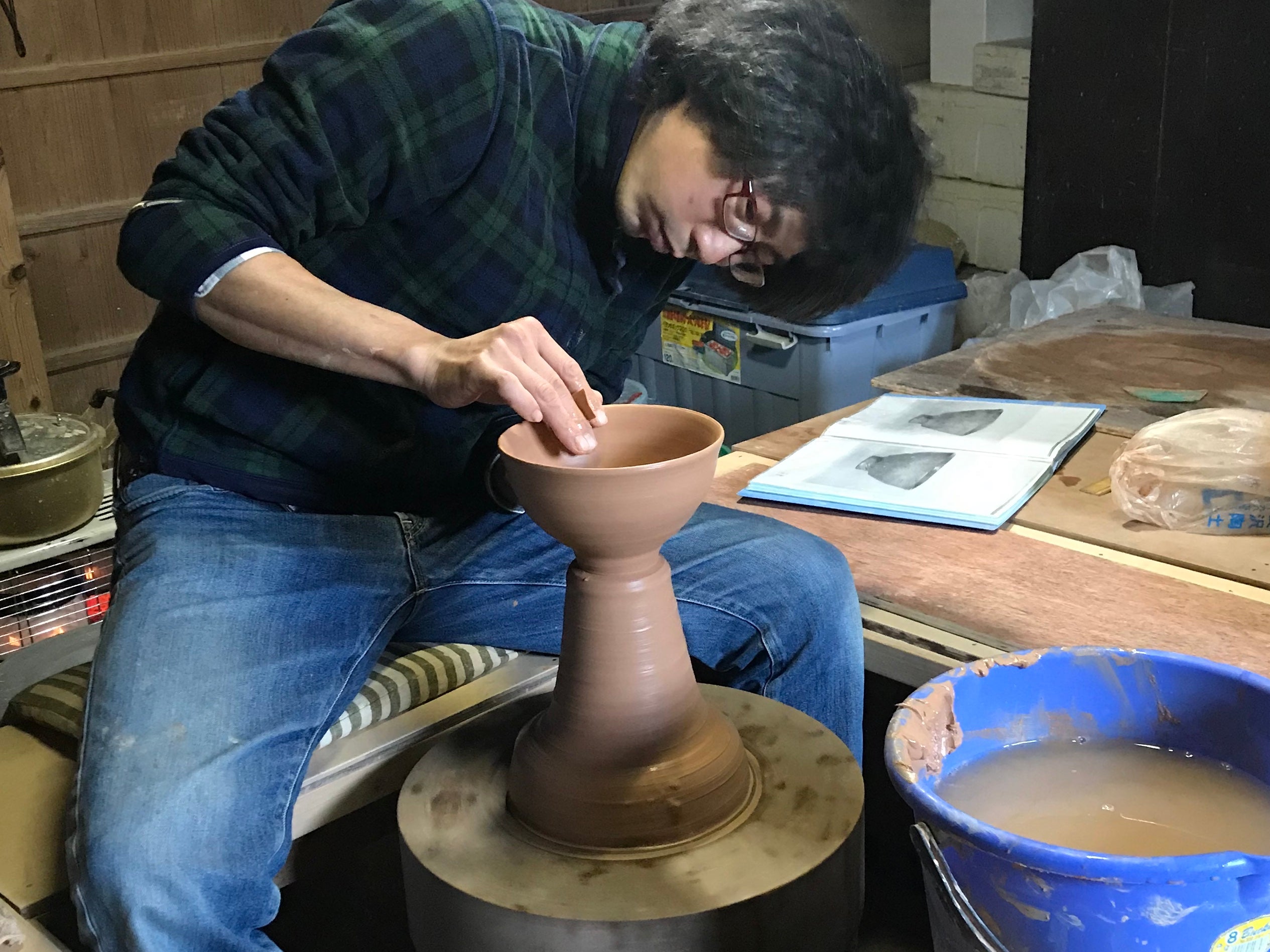 Masanori Makino throwing bowls on his kick wheel in Hagi, Japan