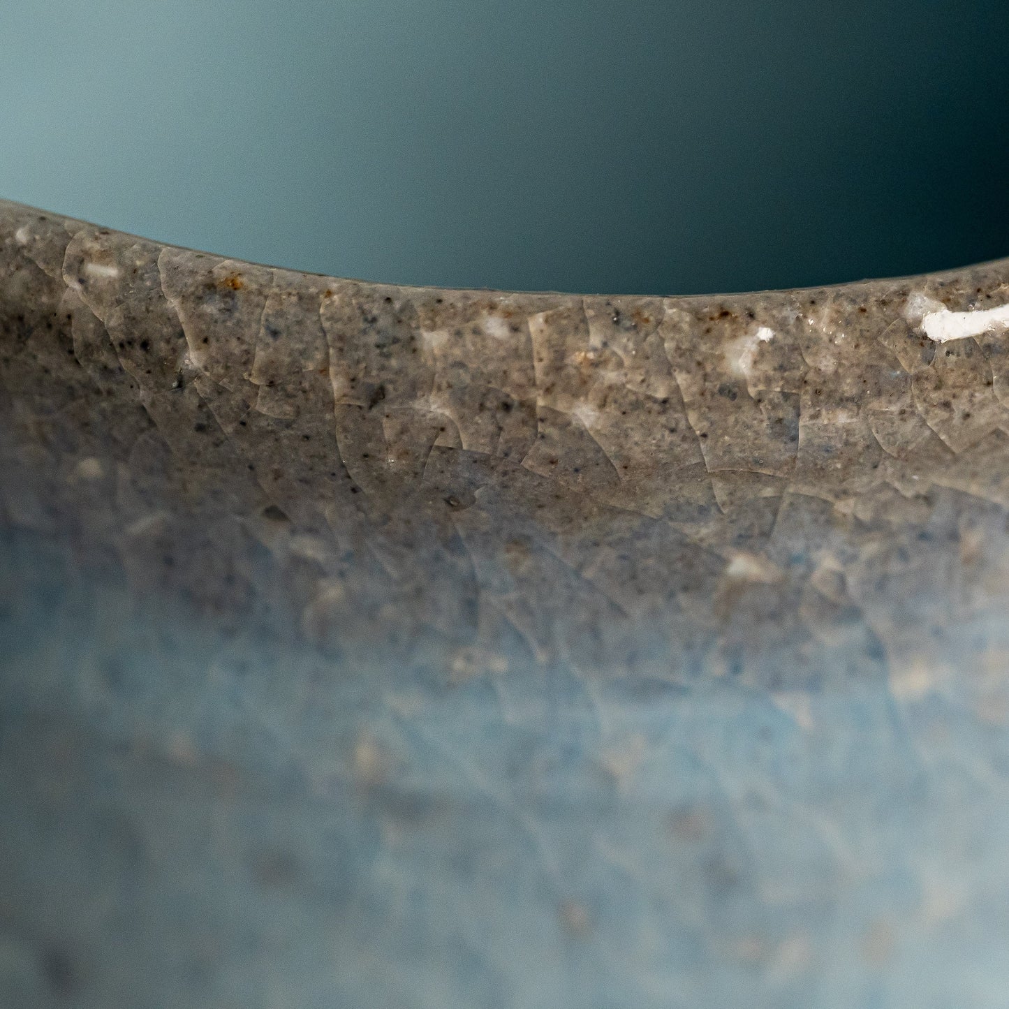 A close up of a blue Hagi yaki teacup