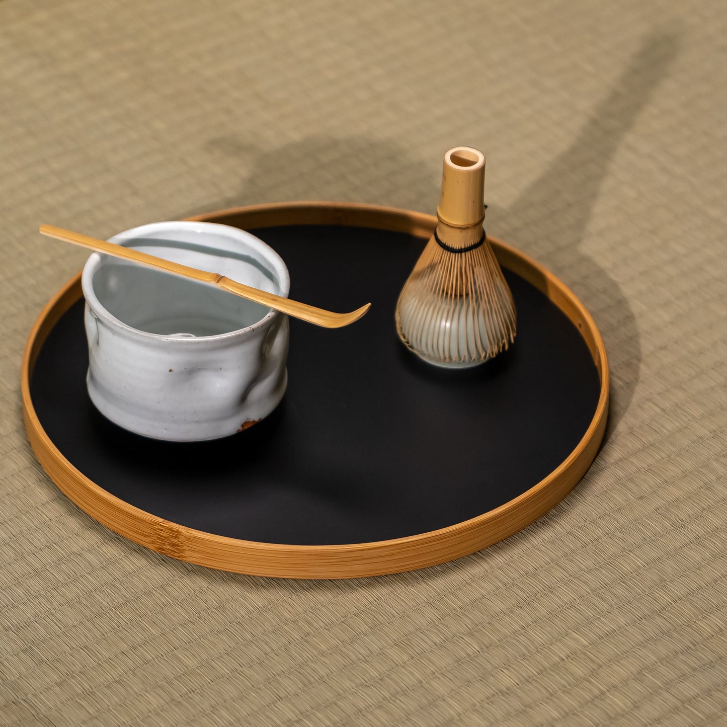 A Japanese tea set on a bamboo tray