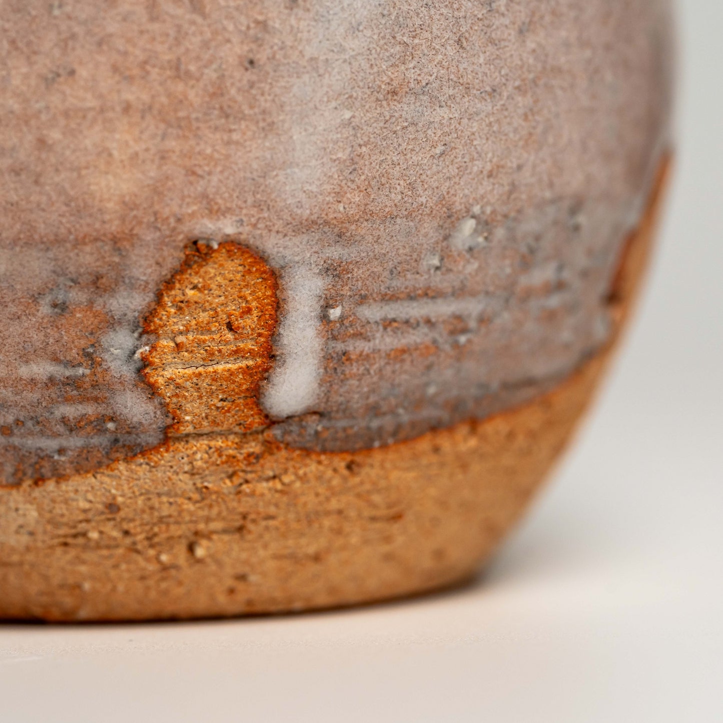 A close up of a pink Hagi yaki sake bottle