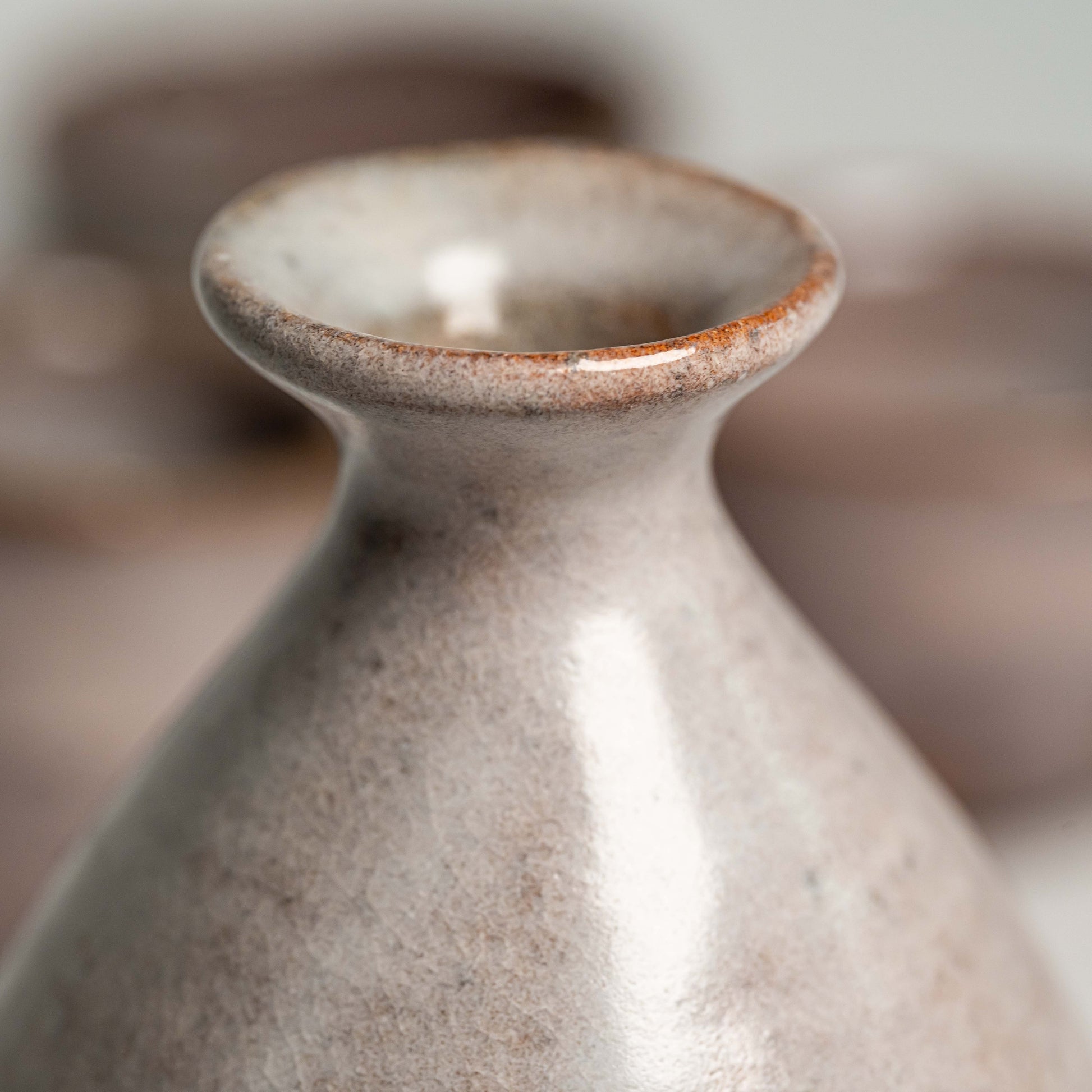 A close up of a pink Hagi yaki sake bottle