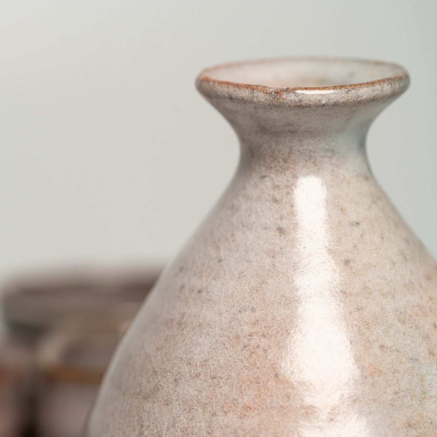 A close up of a pink Hagi yaki sake bottle