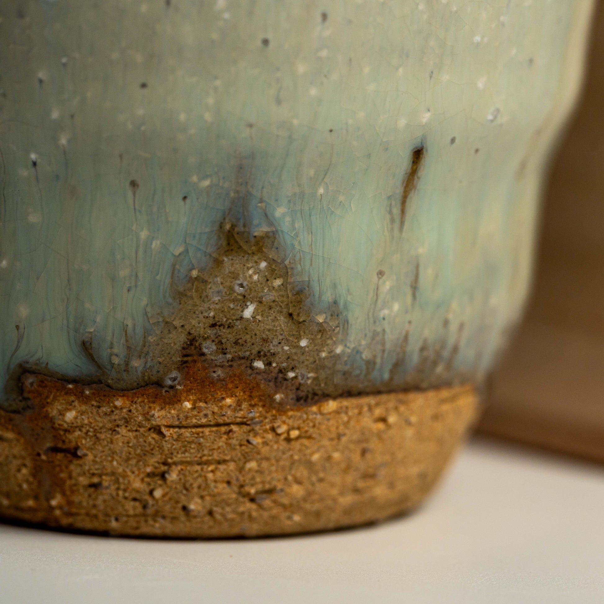 A close up of a green Hagi yaki shochu cup