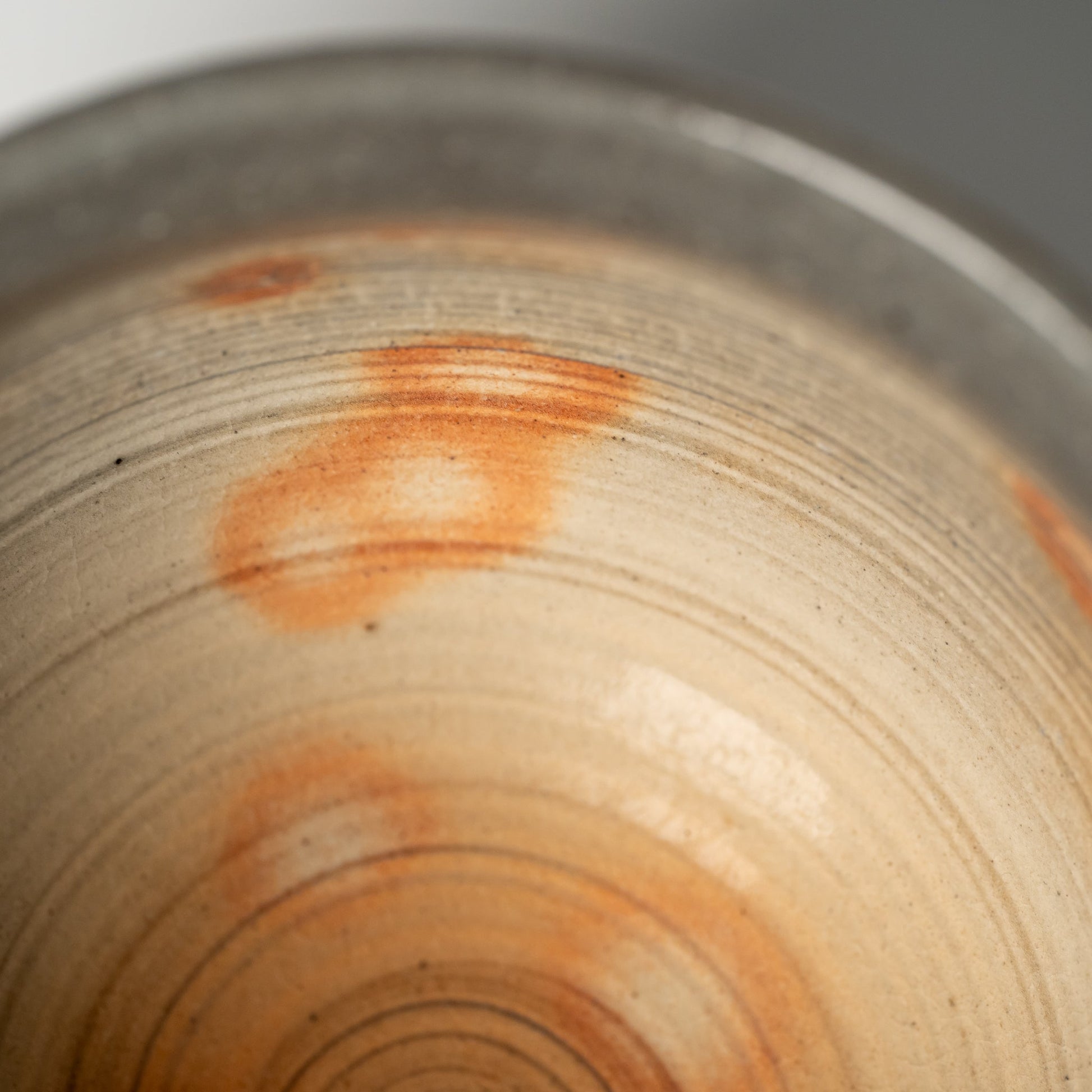 A close up of a small Hagi yaki bowl on a white background