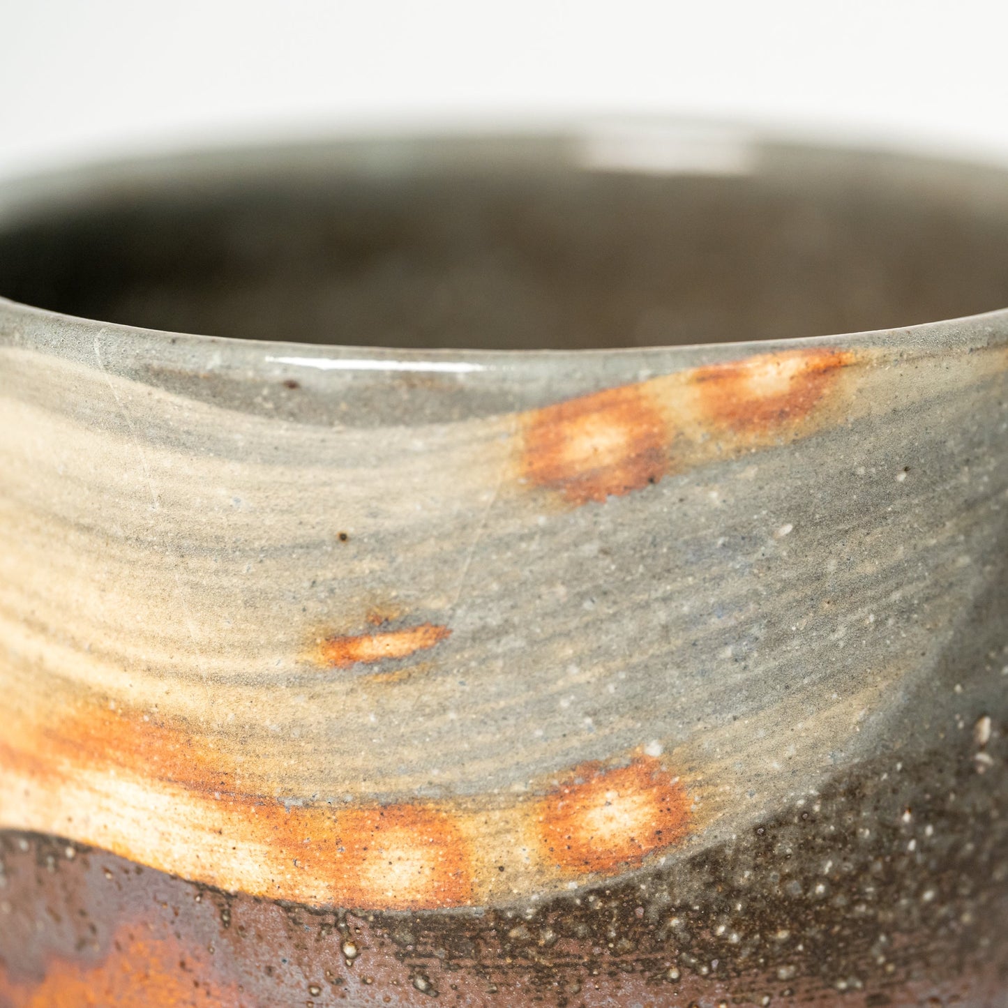 A close up of a brushed Hagi yaki cup