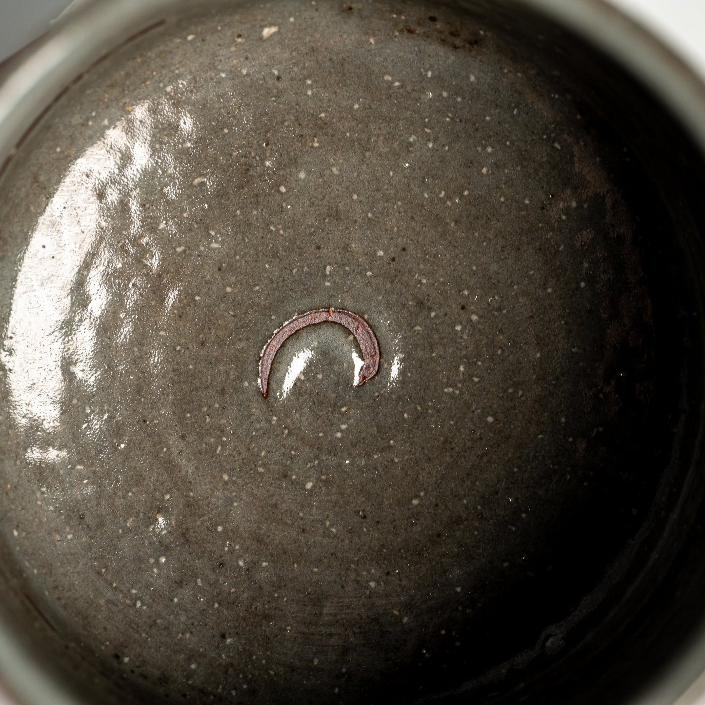 A close up of a brushed Hagi yaki cup
