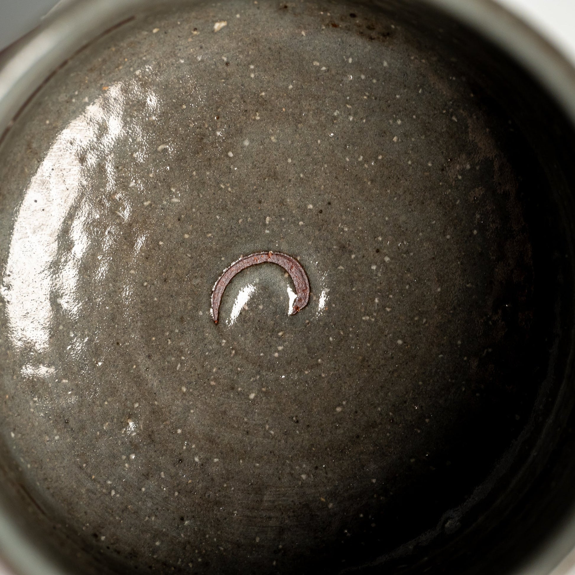 A close up of a brushed Hagi yaki cup