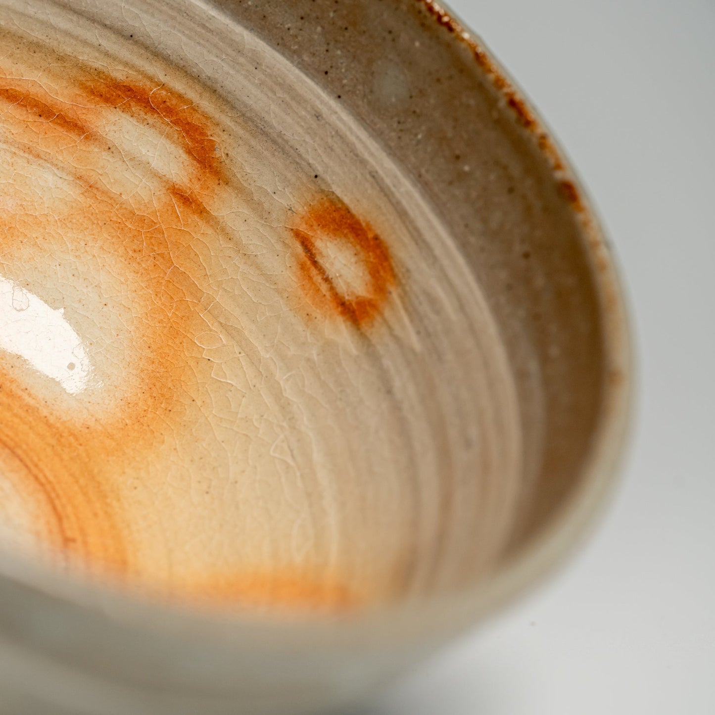A close up of a Japanese Hagi yaki rice bowl on a white background