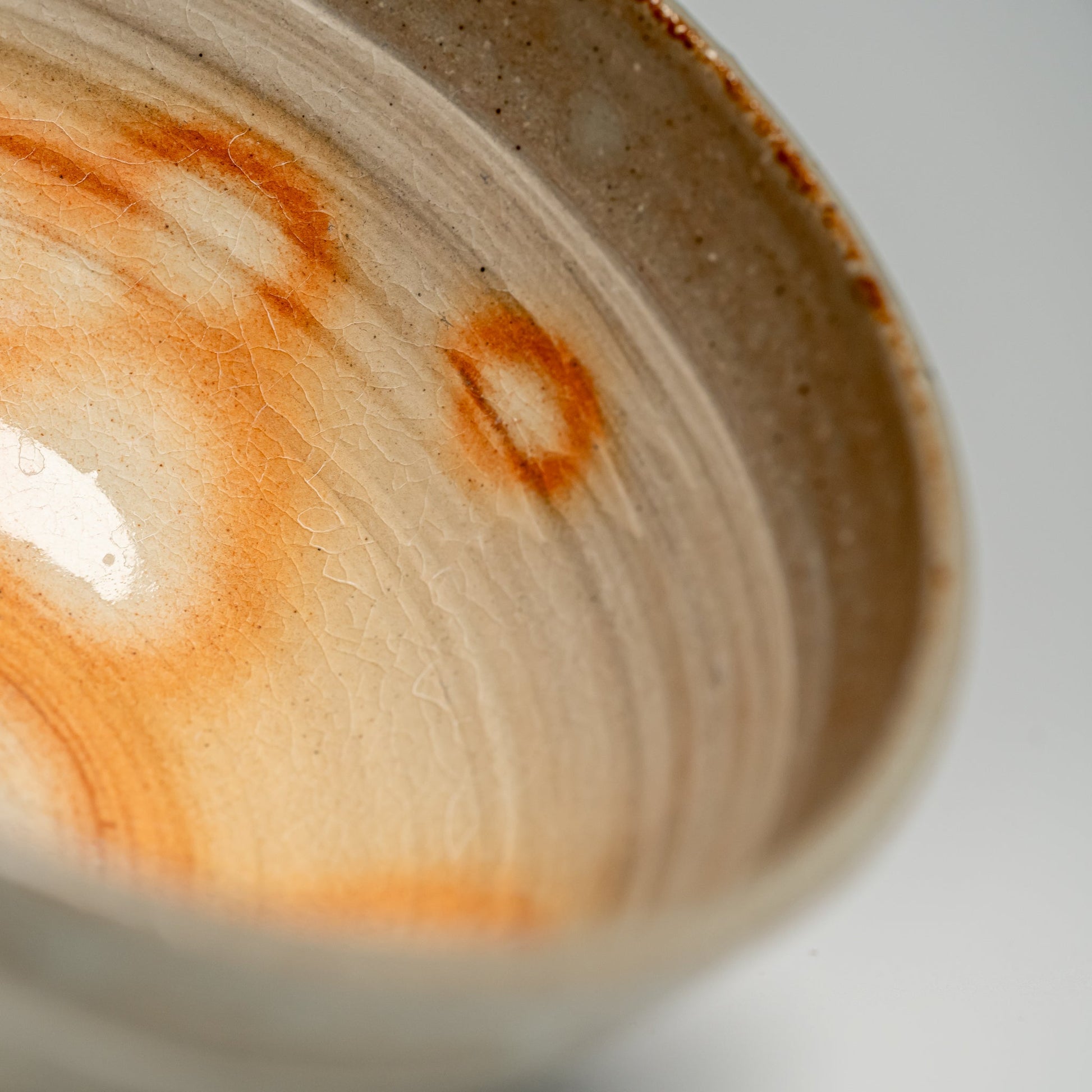 A close up of a Japanese Hagi yaki rice bowl on a white background