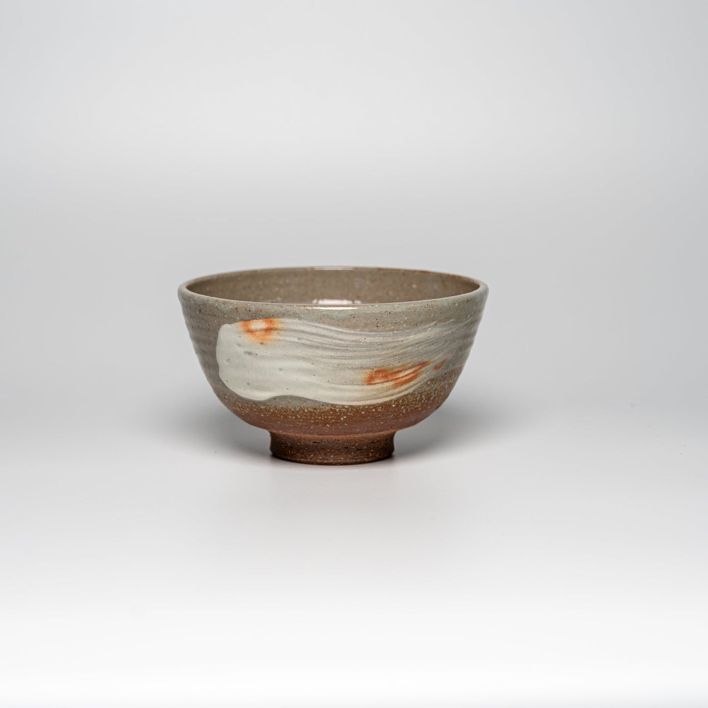 A Japanese Hagi yaki rice bowl on a white background