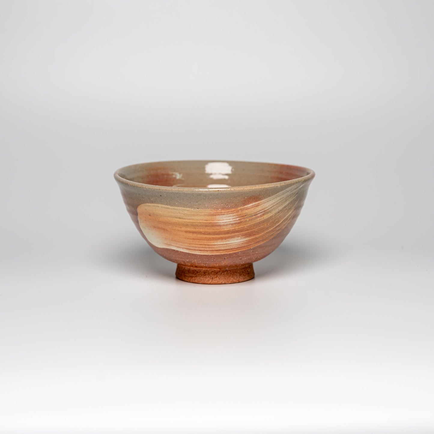 A pink Hagi yaki rice bowl on a white background