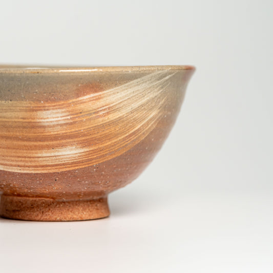 A pink Hagi yaki rice bowl on a white background