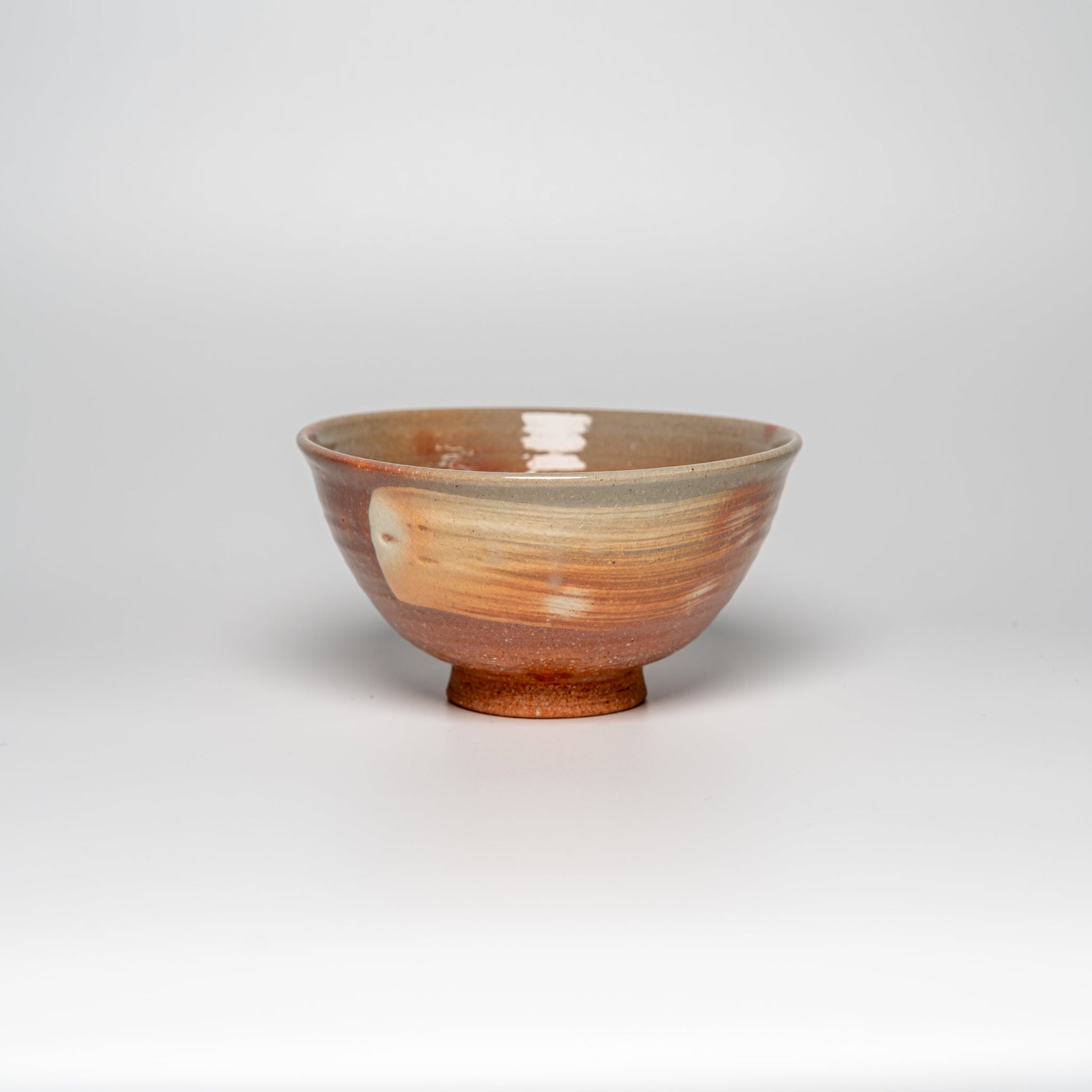 A pink Hagi yaki rice bowl on a white background