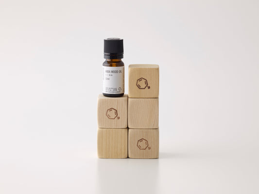 Cul de Sac hiba wood blocks and oil stacked on a white background