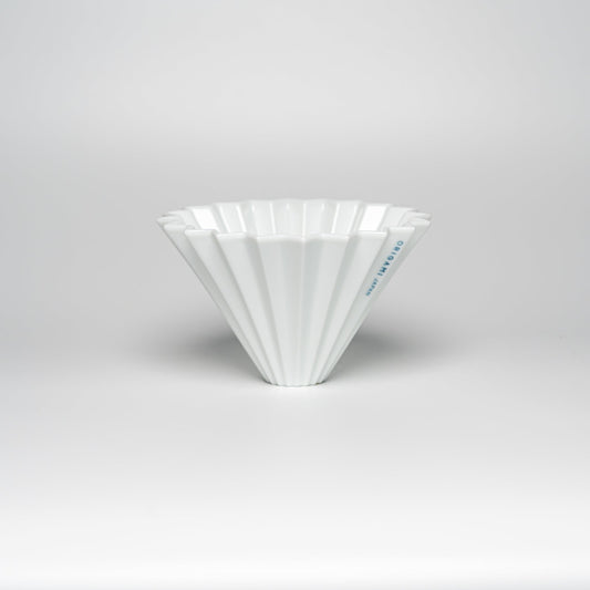 A white ORIGAMI coffee dripper on a white background