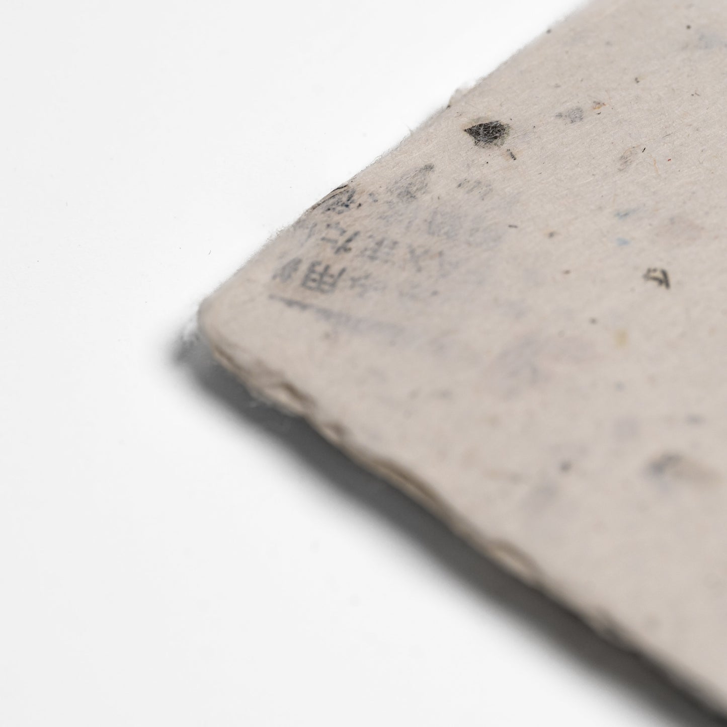Close up of Awagami Factory recycled washi paper cards on a white background