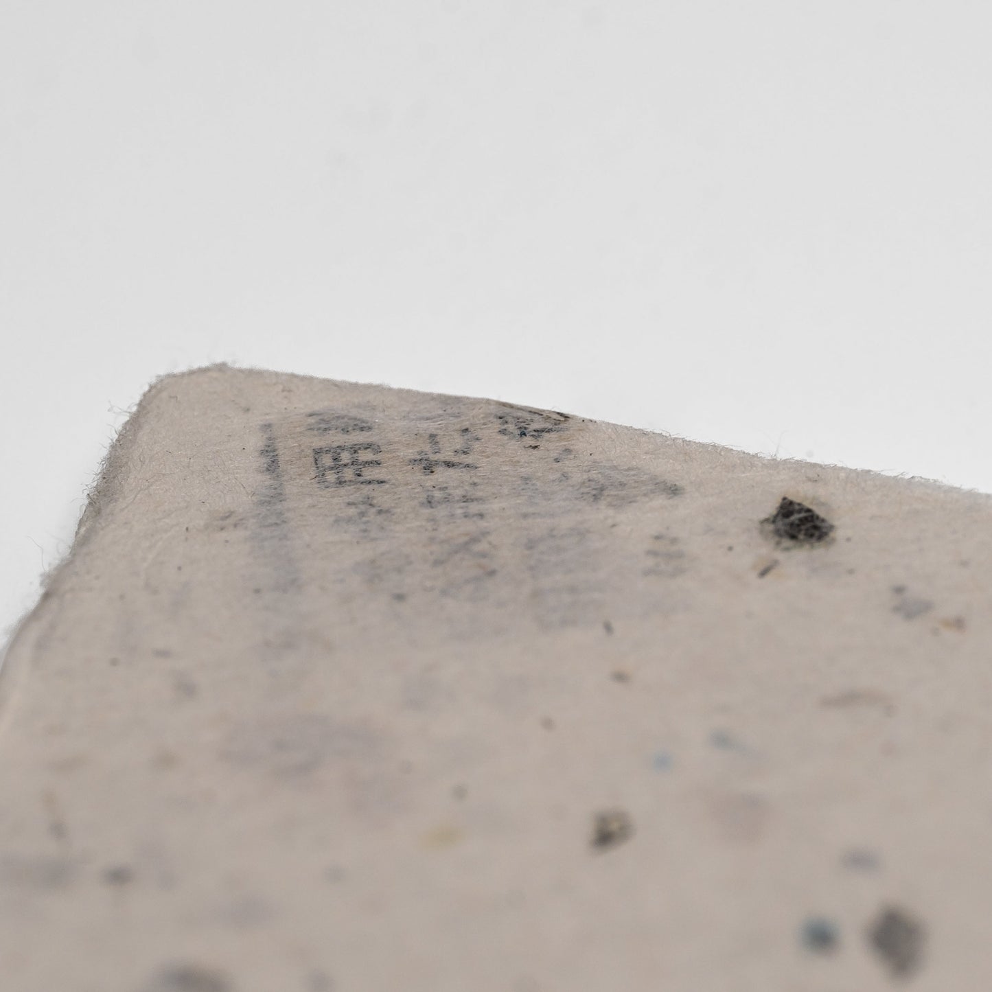 Close up of Awagami Factory recycled washi paper cards on a white background