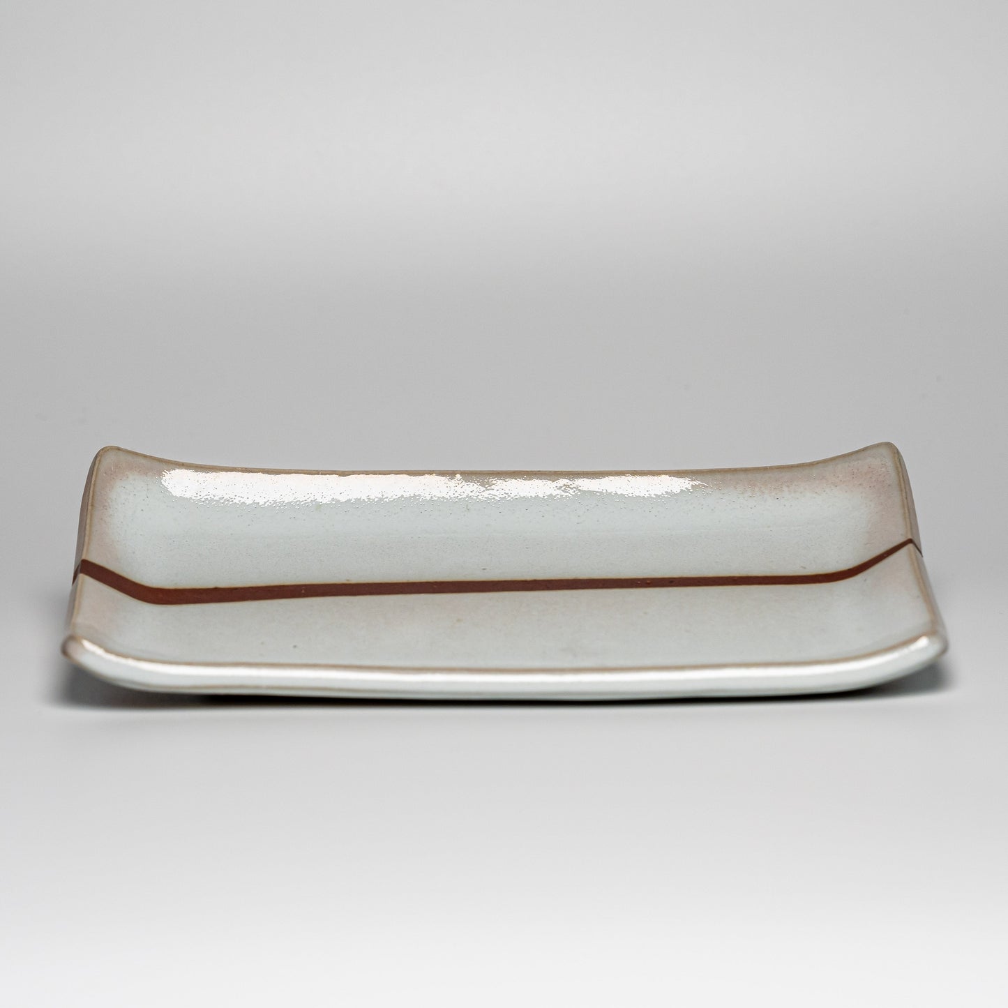 A white Hagi yaki plate on a white background