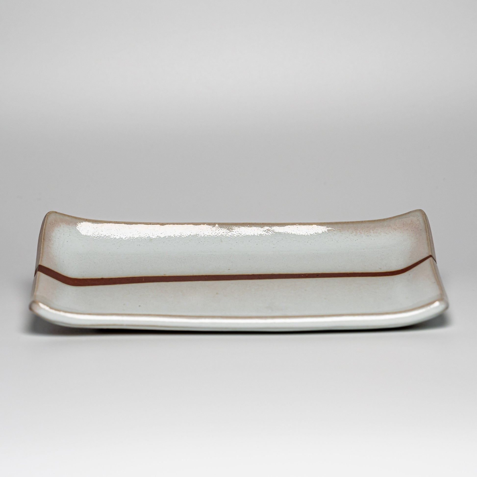 A white Hagi yaki plate on a white background