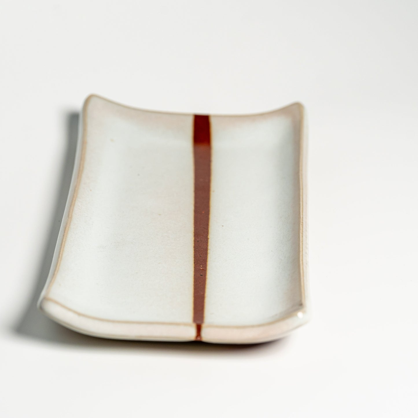 A white Hagi yaki plate on a white background