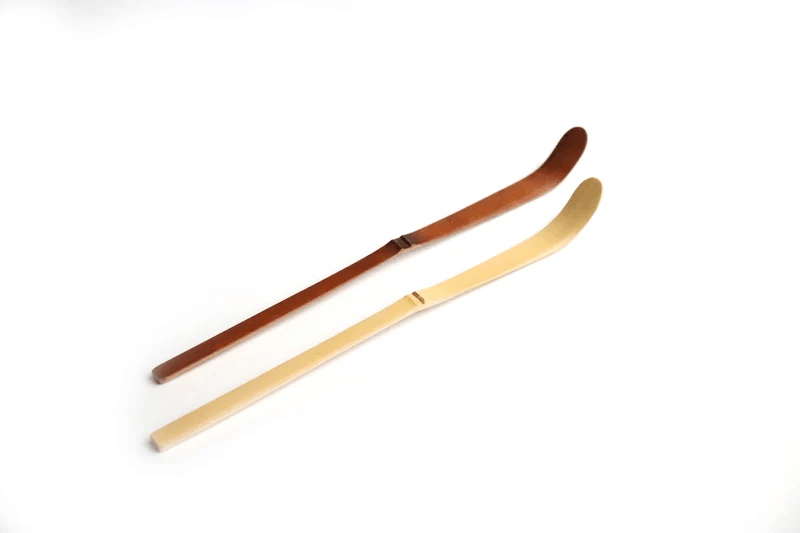 Bamboo tea scoops on a white background