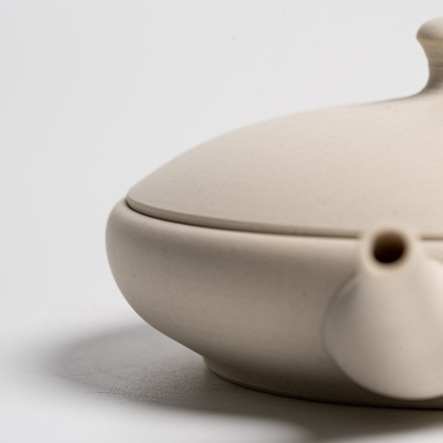 Close up of a Tokoname-yaki Teapot on a white background