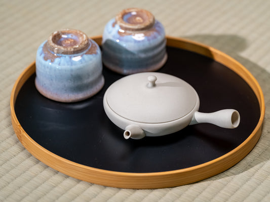Japanese ceramic tea set on a tatami mat